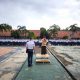 Banjar – Untuk menciptakan lingkungan yang aman dan kondusif selama pelaksanaan Masa Pengenalan Lingkungan Sekolah (MPLS), jajaran Polsek Purwaharja bersama Koramil Banjar melaksanakan kegiatan pengamanan dan pendampingan siswa di SMKN 2 Banjar, Senin (14/7/2025). Kegiatan yang berlangsung sejak pukul 07.00 WIB di lapangan SMKN 2 Banjar, Lingkungan Cipadung, Kelurahan Purwaharja, tersebut melibatkan sejumlah personel gabungan, antara lain Kapolsek Purwaharja AKP Ahmad Iskandar, Kanit I Sabhara, Bhabinkamtibmas, serta Babinsa dari tiga kelurahan: Purwaharja, Karangpanimbal, dan Raharja. Dalam kesempatan itu, personel TNI-Polri hadir tidak hanya untuk menjamin keamanan, tetapi juga memberikan pendampingan kepada peserta didik baru dalam proses pengenalan lingkungan sekolah. Pendekatan edukatif ini menjadi bagian dari implementasi pendidikan karakter berbasis regulasi nasional, dengan tujuan membentuk siswa yang berakhlak, disiplin, dan memiliki rasa tanggung jawab. Kapolsek Purwaharja, AKP Ahmad Iskandar, menjelaskan bahwa pengamanan ini sekaligus menjadi ruang edukasi bagi siswa agar lebih memahami pentingnya nilai-nilai kebangsaan, etika sosial, dan menjauhi perilaku menyimpang seperti kenakalan remaja, perundungan, serta penyalahgunaan media sosial. “Kegiatan MPLS bukan hanya sekadar rutinitas tahunan, tetapi sarana awal untuk menanamkan karakter positif sejak dini,” ungkap Kapolsek. Sementara itu, Kapolres Banjar, AKBP Tyas Puji Rahadi, S.I.K., menyampaikan apresiasi atas sinergi yang terjalin antara Polri, TNI, dan pihak sekolah dalam mengawal proses pendidikan generasi muda. “Kami berkomitmen untuk hadir tidak hanya sebagai penjaga keamanan, tapi juga sebagai mitra edukatif dalam membangun karakter generasi penerus bangsa,” tegas Kapolres. Kegiatan berlangsung dengan lancar dan penuh antusiasme dari para siswa dan pihak sekolah.